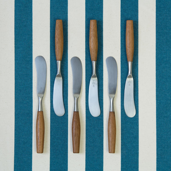 Six Jens Quistgaard Butter Spreaders from the 'Fjord' series designed in 1953. Each blade is stamped with the makers name 'Dansk Design' Quistgaard's initials 'IHQ' and the famous four ducks logo.