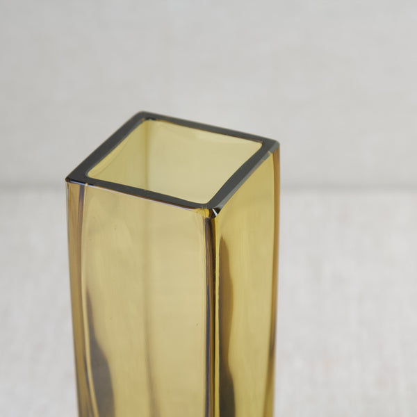 Top down view showing the rim and mouth of a model 296 vase by Kaj Franck for Nuutajärvi Notsjö, this example is in honey-yellow coloured glass..