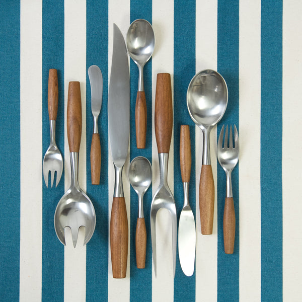 Mood image showing 10 pieces of Jens Quistgaard 'Fjord' flatware. Each piece is a different design. This rare and collectible MidCentury Scandinavian design and many others are available for sale in the UK. London based Nordic design gallery Art & Utility offer worldwide shipping.