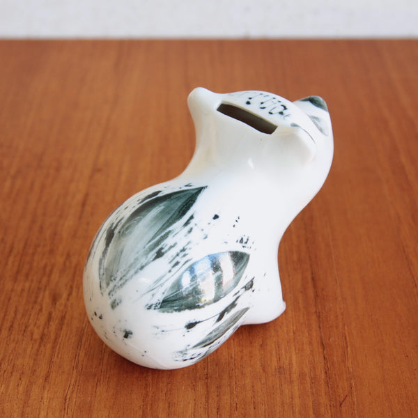 Top down view of a large slip-cast porcelain bear money box with a slot for money in its head. The design is by Susan Parkinson, a charming example of British Modernist pottery.