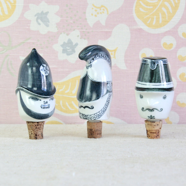 Three decorative ceramic bottle stoppers by Susan Parkinson and Guy Neale each porcelain bottle topper is freely hand decorated in the distinctive style of the Parkinson Pottery.