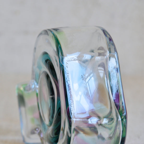 Detail of hand written etched signature of Helena Tynell. Manufacturer Riihimäen Lasi is also written. Item is a Bora Bora vase, an experimental Finnish studio production art glass piece.