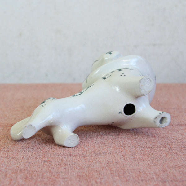 Susan Parkinson lion, crafted in Kent, inspired by Modernist British sculpture. Photo shows underside of figurine which is stamped with the makers marks on two of the four feet.