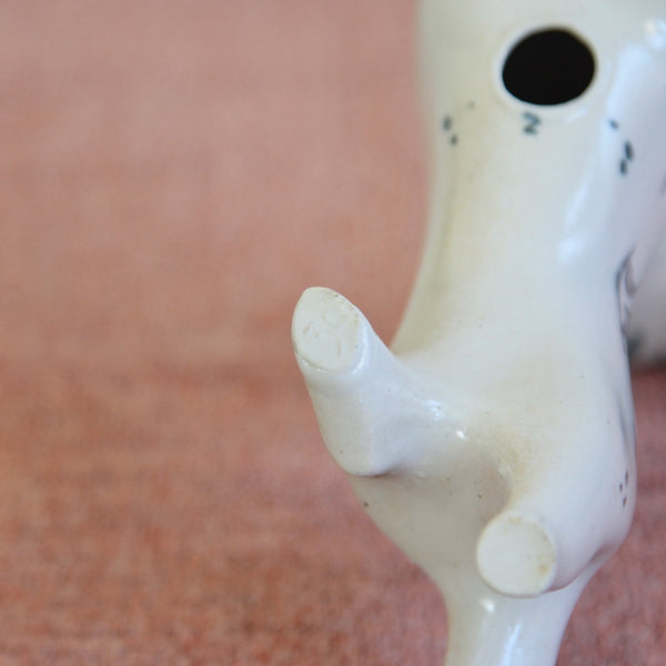 Close-up of a ceramic lion figure which is impressed with the makers mark. 1950s Modernist Susan Parkinson design.
