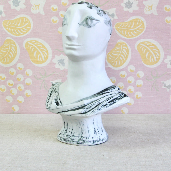 A white ceramic classical bust sculpture with hand painted black detailing. This large Modernist bust, of an ancient Greek gentleman, was designed and made by Susan Parkinson around 1953.