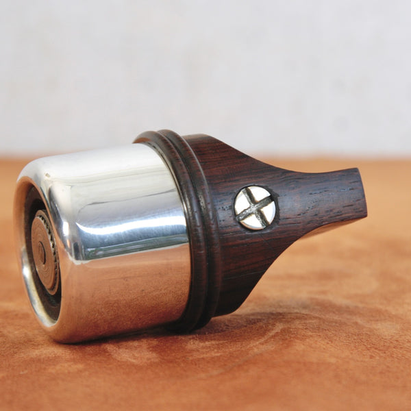 Silver-plated band and crosshead screw detail on a vintage rosewood pepper mill by Jens Quistgaard for Dansk Designs. Available for worldwide shipping from ordic design gallery Art & Utility.