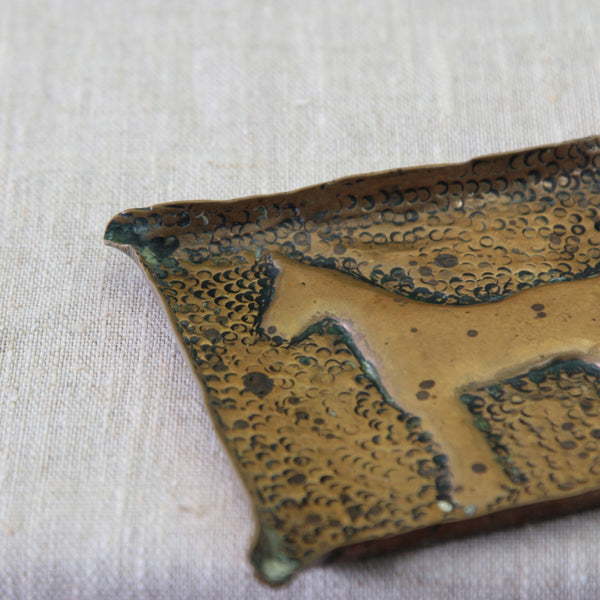 Vintage 1950s hammered brass decorative tray, an individual example of British mid-century craft and naïve folk art.