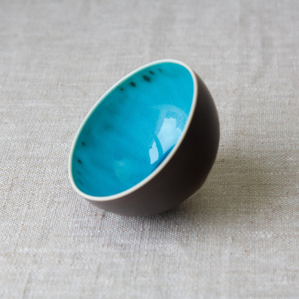 Vibrant blue glossy glaze inside an Arabia Finland tea bowl, designed by ceramicist Friedl Holzer-Kjellberg