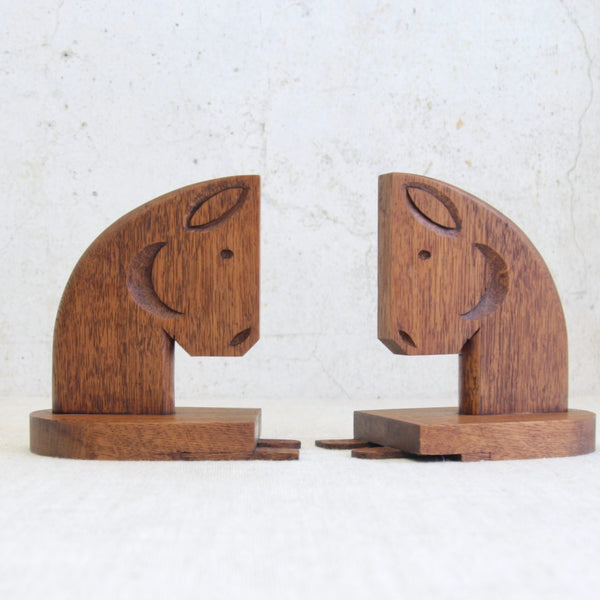 Mid-century British horse head bookends carved from solid oak, highlighting skilled artisan woodworking and timeless design.