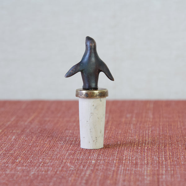 Head on shot of the reverse or back of a short little penguin figurine from the 1950s. Own a piece of design history with this vintage Walter Bosse penguin bottle stopper.