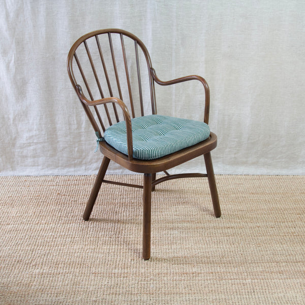 Own a rare Danish Windsor chair by Niels Eilersen, showcasing midcentury modern elegance.