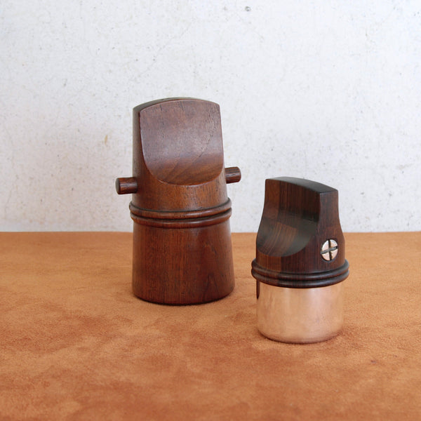 A tactile modernist teak “whistle” pepper mill by Jens Quistgaard for Dansk Designs, blending utility with Scandinavian artistry.