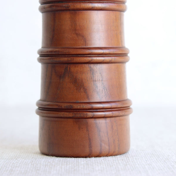 Grain detail on a rare teak wood Jens Quistgaard pepper mill in Scandinavian modern for Dansk Designs.