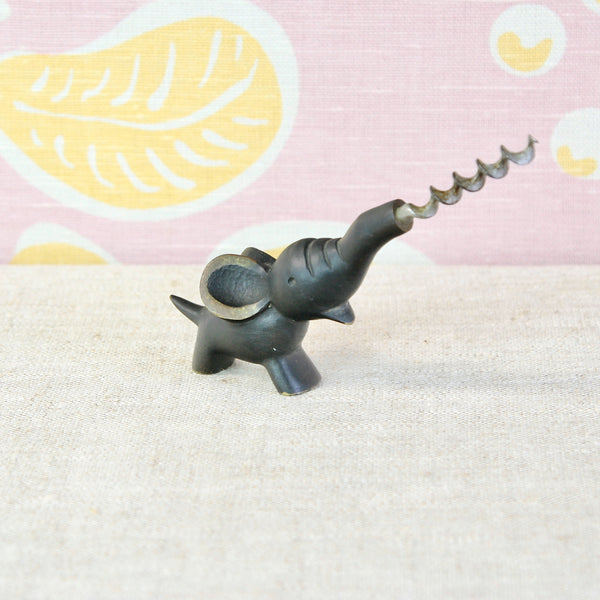 Walter Bosse elephant wine opener in solid brass and steel, with contrasting black patination and polished golden details.