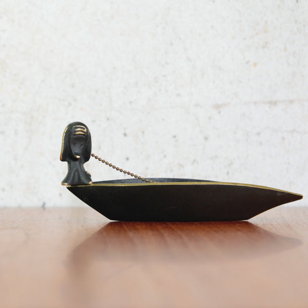 Head on shot of a collectible mid-century brass boat tray by Walter Bosse, a dog figurine that functions as a tamper is included, handmade in Vienna by Herta Baller. Mid-century modern Viennese design.