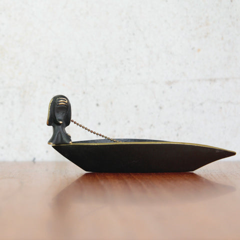 Head on shot of a collectible mid-century brass boat tray by Walter Bosse, a dog figurine that functions as a tamper is included, handmade in Vienna by Herta Baller. Mid-century modern Viennese design.