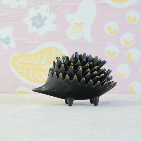 Six individual Walter Bosse hedgehogs arranged together, showing the different sizes and characters that make up the complete stacking ashtray set.