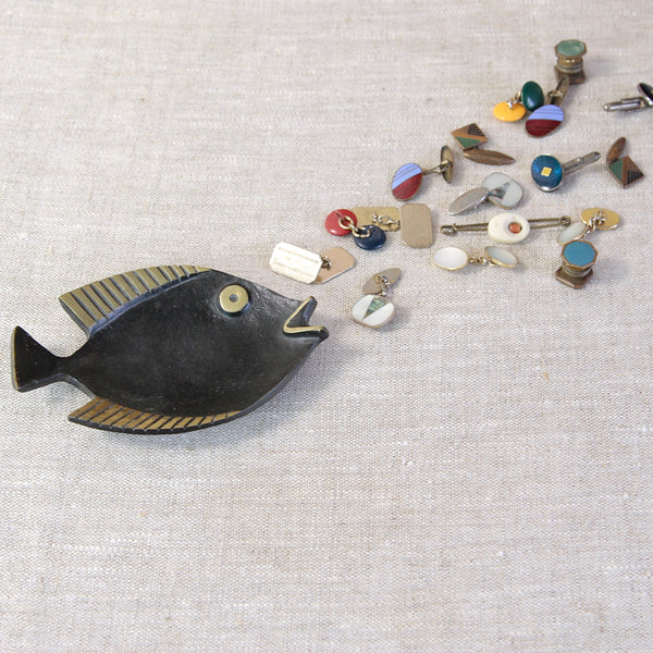 Mid-century Austrian brass fish tray by Walter Bosse for Herta Baller, available from UK design gallery Art & Utility. Photographed with Vintage enamel and bakelite cufflinks.