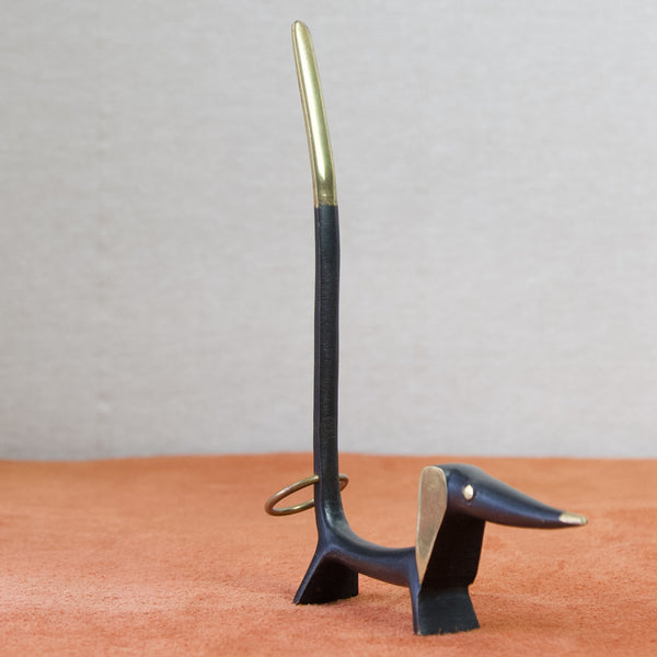 Modernist abstract dachshund black patinated brass pretzel holder, designed by Walter Bosse for Baller Austria