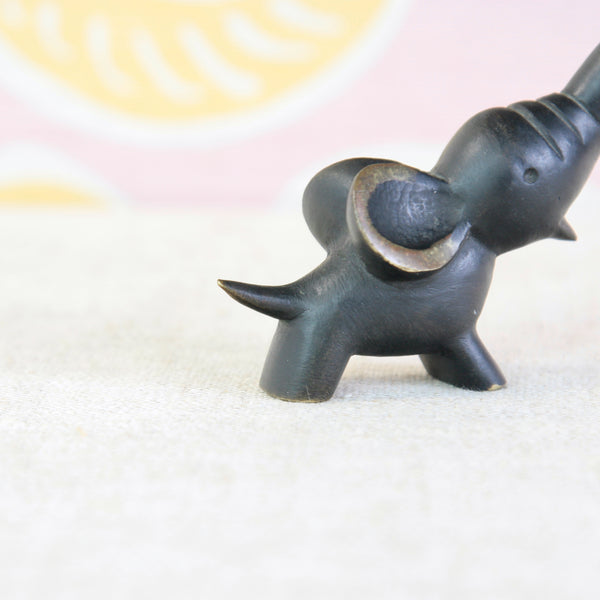 Collectable Walter Bosse elephant corkscrew, a playful piece of vintage 1950s barware in black and golden brass.