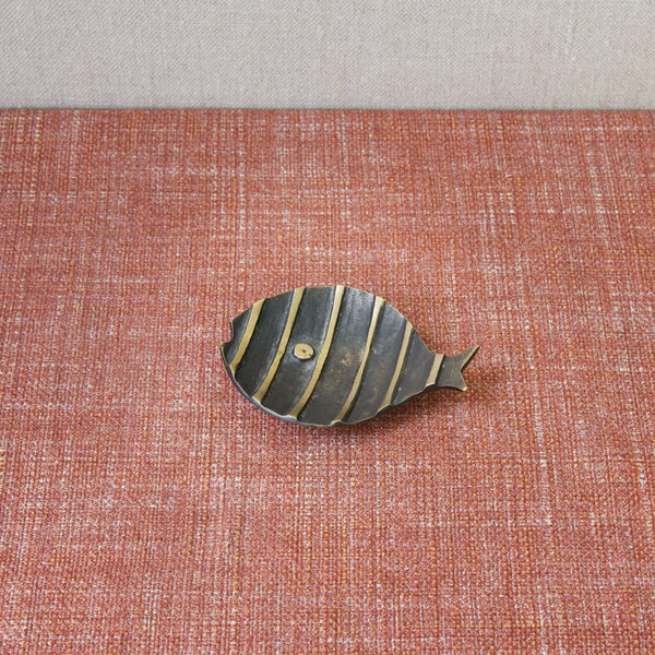 Top down view of a Walter Bosse Fish shaped dish featuring stripes in black and golden yellow. Collectable mid-century design made by Herta Baller, Austria..