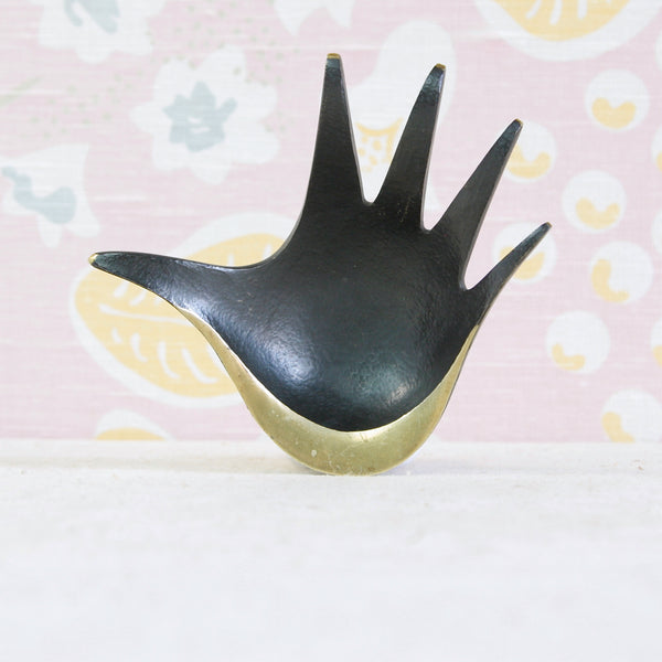 Elegant brass hand-shaped ashtray designed by Walter Bosse, with long tapered fingers and an outstretched thumb.