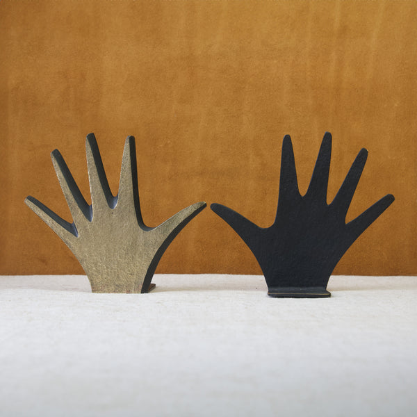 Walter Bosse modernist brass bookends in the shape of a hand showing both polished and patinated surfaces