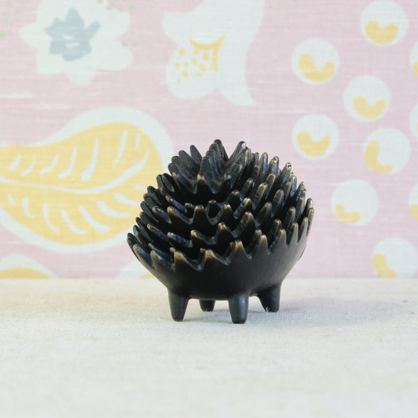 Black and gold patinated brass hedgehog family by Walter Bosse, an iconic example of playful post-war Modernist design.