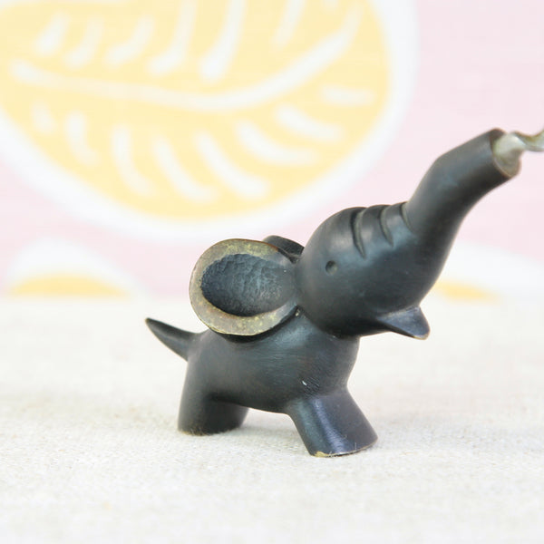 Walter Bosse baby elephant corkscrew in black and golden brass, available from UK design gallery Art & Utility.