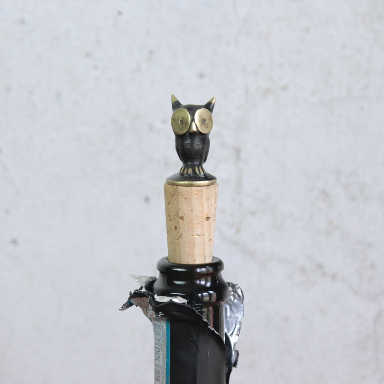 Head on profile image of a Walter Bosse owl shaped bottle stopper made by Herta Baller in 1950's Vienna, Austria.