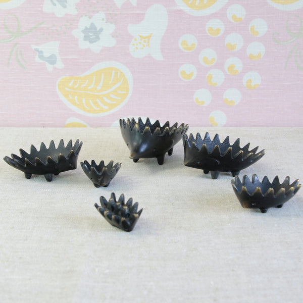Complete six-piece Walter Bosse hedgehog ashtray set, with graduating brass figures designed to stack neatly inside one another.