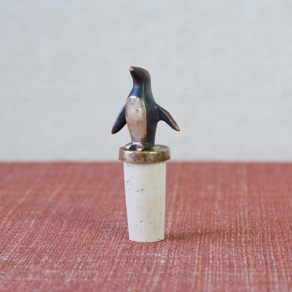 Penguin shaped bottle stopper in black patinated and polished brass. Design by Walter Bosse for Herta Baller. This vintage MidCentury collectible and many more are available for sale in the UK from Art & Utility, a design gallery specialising in Northern European & Scandinavian Design.