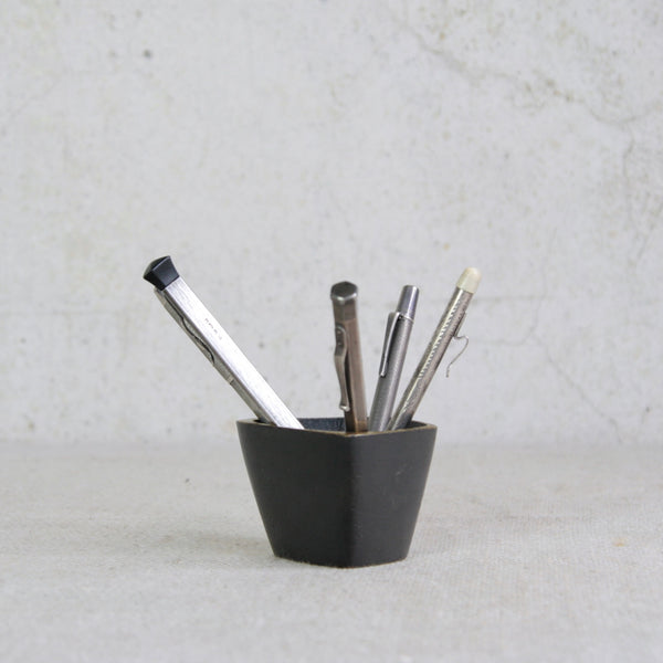 Walter Bosse 1950s square vessel in brass, shown with antique silver pens, reflecting stylish mid-century modernism.