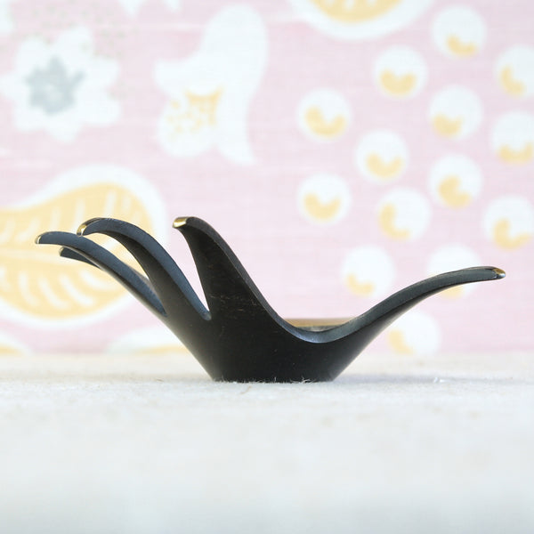 Mid-century Walter Bosse brass hand showing the elegant curved fingers and black patinated surface associated with Herta Baller production.