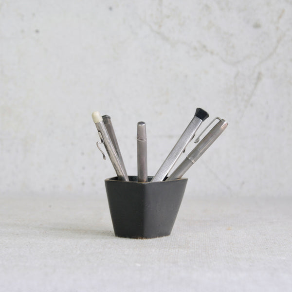 A Walter Bosse brass container produced by Baller Austria, mid-century Vienna, with sculptural modernist design. Shown with antique sterling silver pens and stationary. 