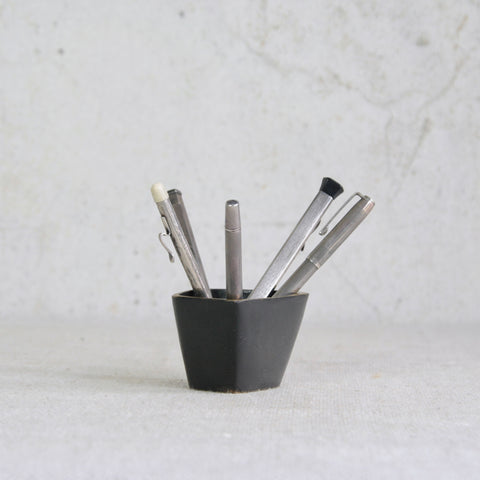 A Walter Bosse brass container produced by Baller Austria, mid-century Vienna, with sculptural modernist design. Shown with antique sterling silver pens and stationary. 