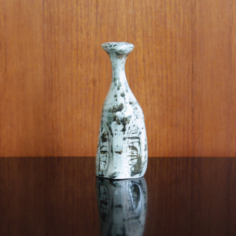 Gloss-glaze porcelain cat sculpture by Susan Parkinson, inspired by Nicolas Vergette, collectible and elegant.