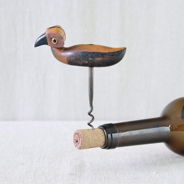 1920s YZ bird corkscrew combining contrasting natural and early synthetic materials including wood, rattan, glass and Bakelite.