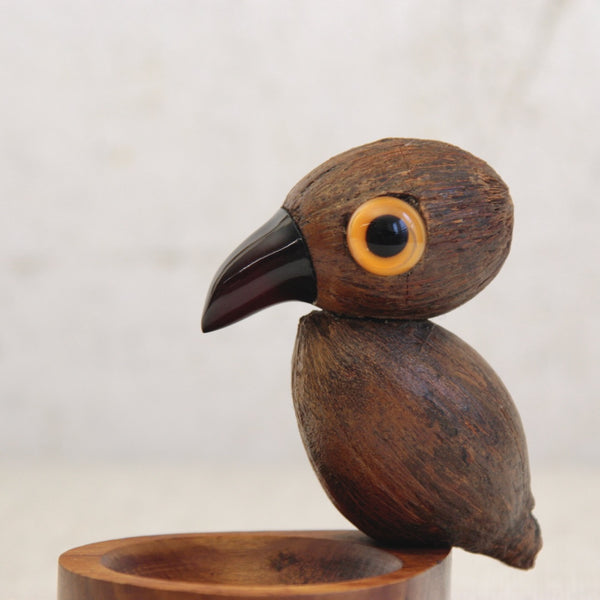 Art Deco YZ nut bird tray showing detailed craftsmanship, with coquilla nut body, cherry amber Bakelite beak and cased glass eyes.