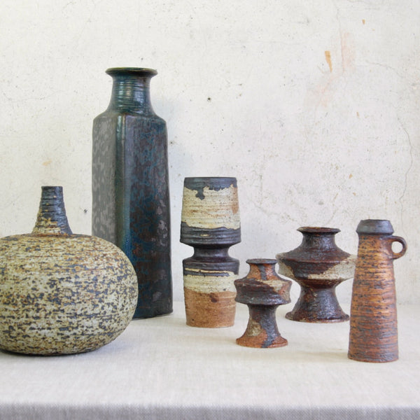 Artistic mood shot/still life showing a group of pottery from the Finnish pottery studio of Arabia. 5 vases are by Annikki Hovisaari Vase, 1 vase, the tallest, is by Francesca-Mascitti-Lindh. Museum qualirt Mid-Century-Modern Scandinavian Design. For sale in the UK from Nordic design gallery Art & Utility.