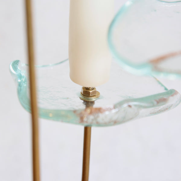 Rare asymmetric Swedish candlestick, floral brass base with sculptural glass flower heads.