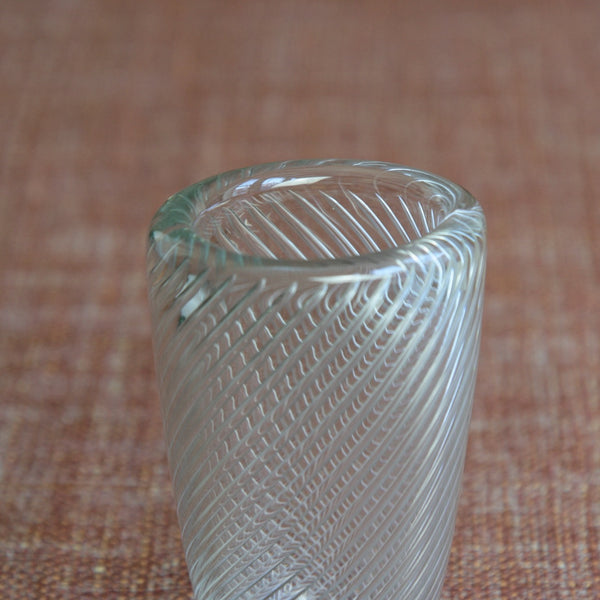 Scandinavian design Vire vase by Kaj Franck, displaying the swirling optical pattern in clear glass. A rare and prized Nordic collectible. For sale in the UK from Art & Utility who offer global shipping.