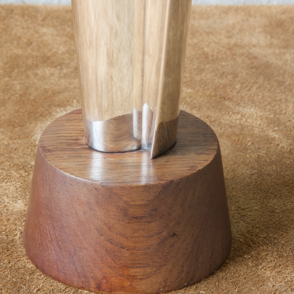 Close up showing the wood grain of the teak base on a Tapio Wirkkala vase produced by Kultakeskus Oy, Finland. 