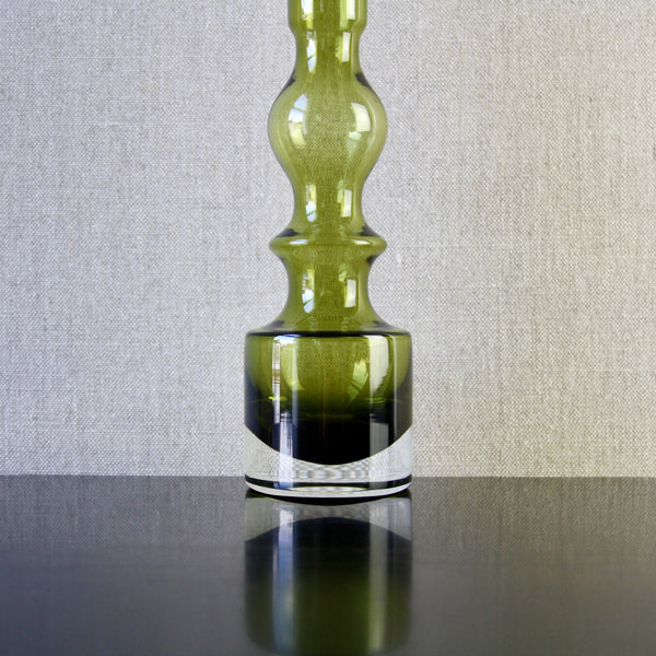 Detail shot showing foot of a pompadour vase. Image shows the clarity of the glass used and that the object is cased glass