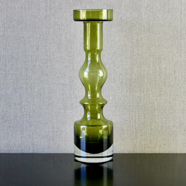 front shot of tall vibrant green glass candlestick by Finnish glass designer Nanny Still