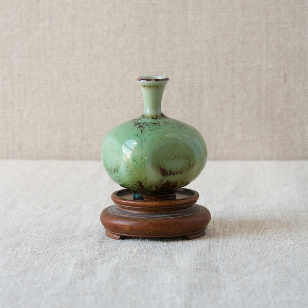 A petite Berndt Friberg vase with a turquoise green and oxblood-red sang de boeuf glaze. This vintage original Scandinavian design and many others are available to view in Southwest London at Art & Utility. The design gallery offer worldwide shipping to places such as Japan, China, Singapore, and America.