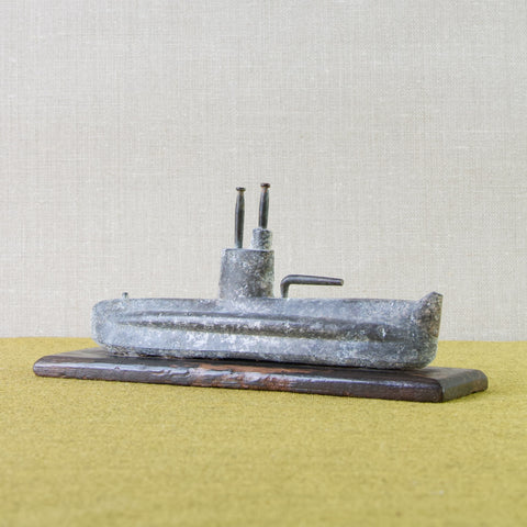 Lead profile image of a WWII era cast lead submarine ship. Handmade in Britain in the early- to mid-twentieth century.