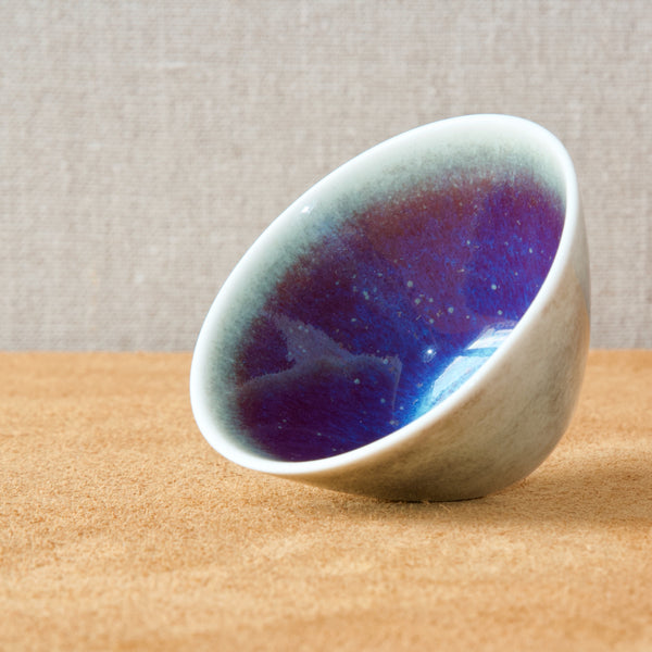 Cobalt blue and purple glaze inside a white satin glazed bowl from Rorstrand Sweden