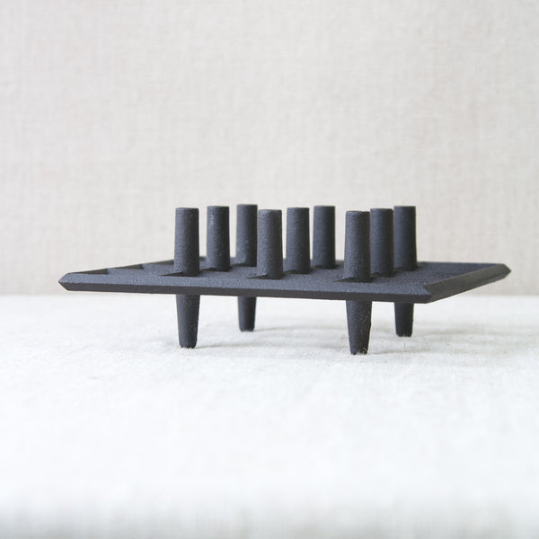 Jens Quistgaard cast iron 'Trivet' candle holder for tiny taper candles 