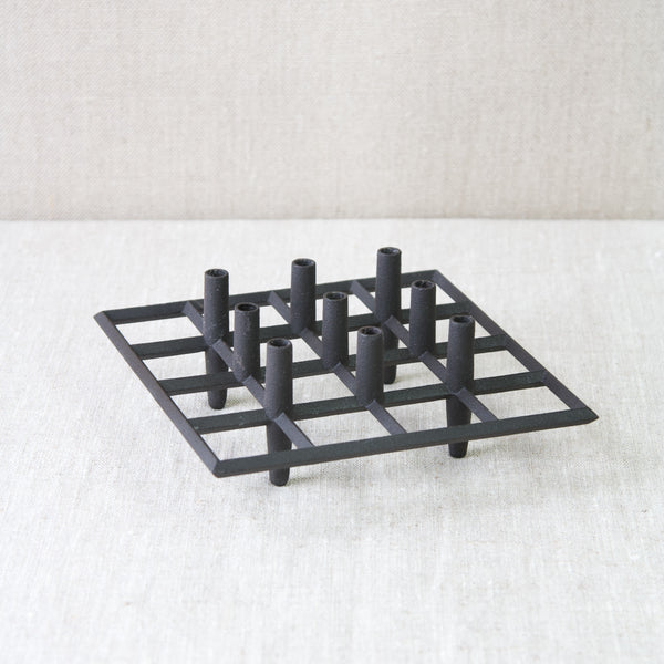 rare Jens Quistgaard cast iron brutalist metal candle holder for tiny taper candles 1960s made in Denmark for Dansk Designs